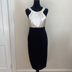 Night out or formal evening out. Sexy white and black dress! Form fitting!